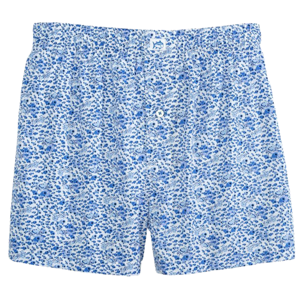 A pair of blue and white floral-patterned men's boxer shorts with an elastic waistband and a button fly.